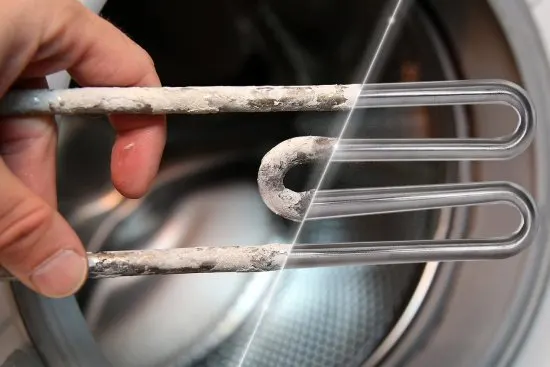 Heating element of a washing machine, half clean and half covered with limescale.